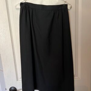 Black linen below the knee skirt . Kick pleat . Sz 8-10